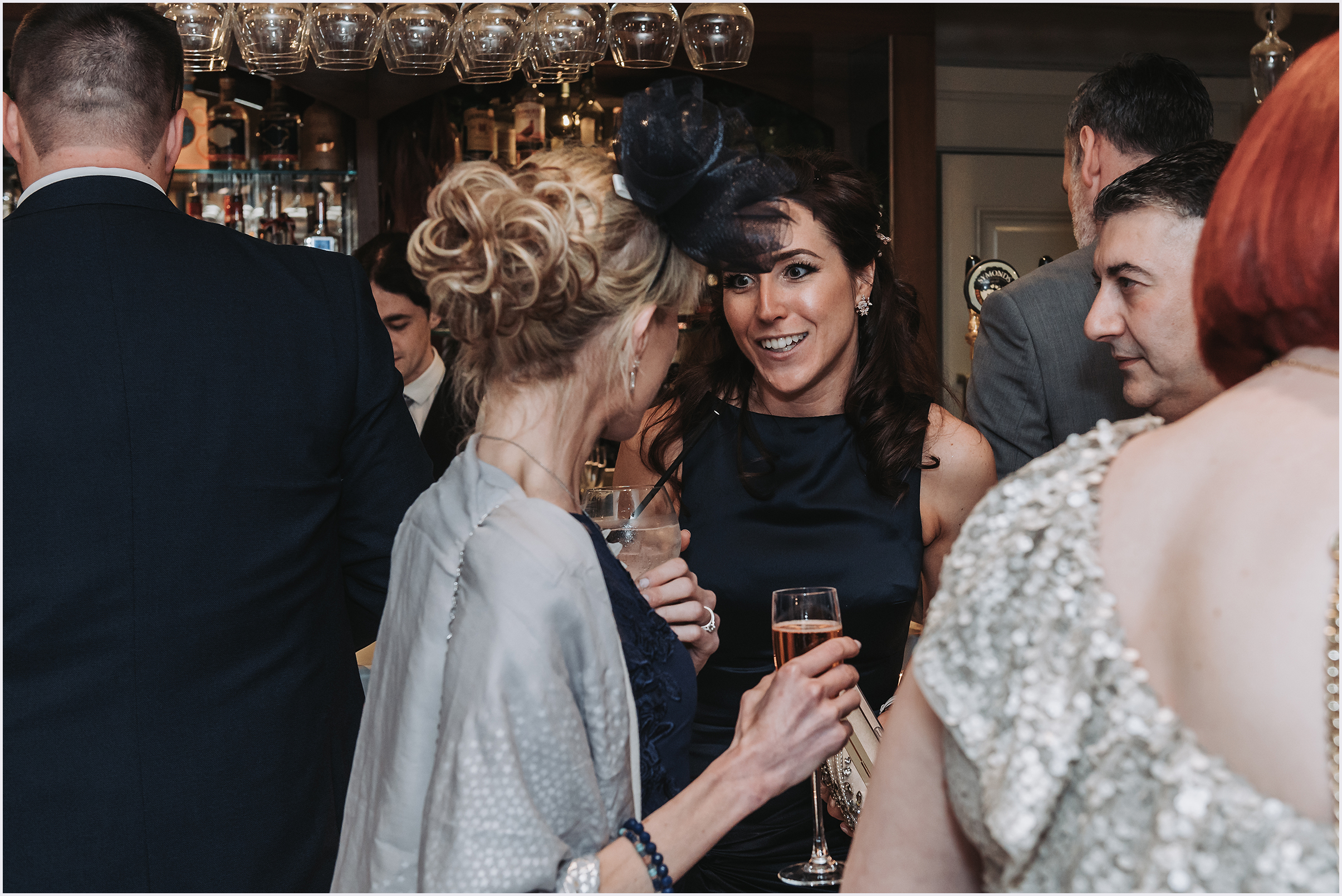 Guests chatting happily during a wedding drinks reception at The Grosvenor Pulford Hotel and Spa.