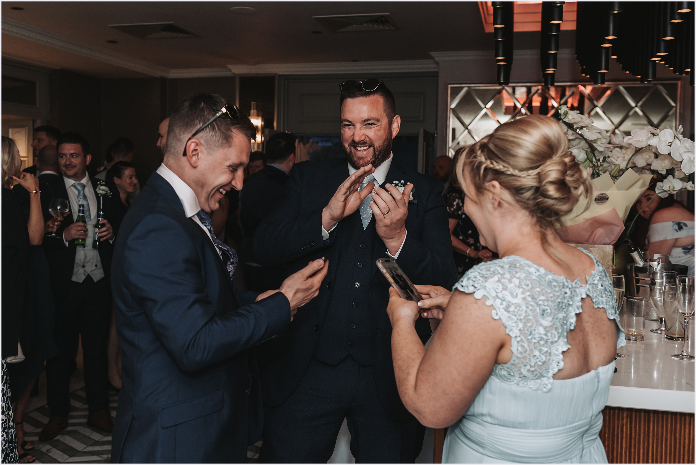 Wedding guests joking around during the drinks reception at The Grosvenor Pulford Hotel and Spa.