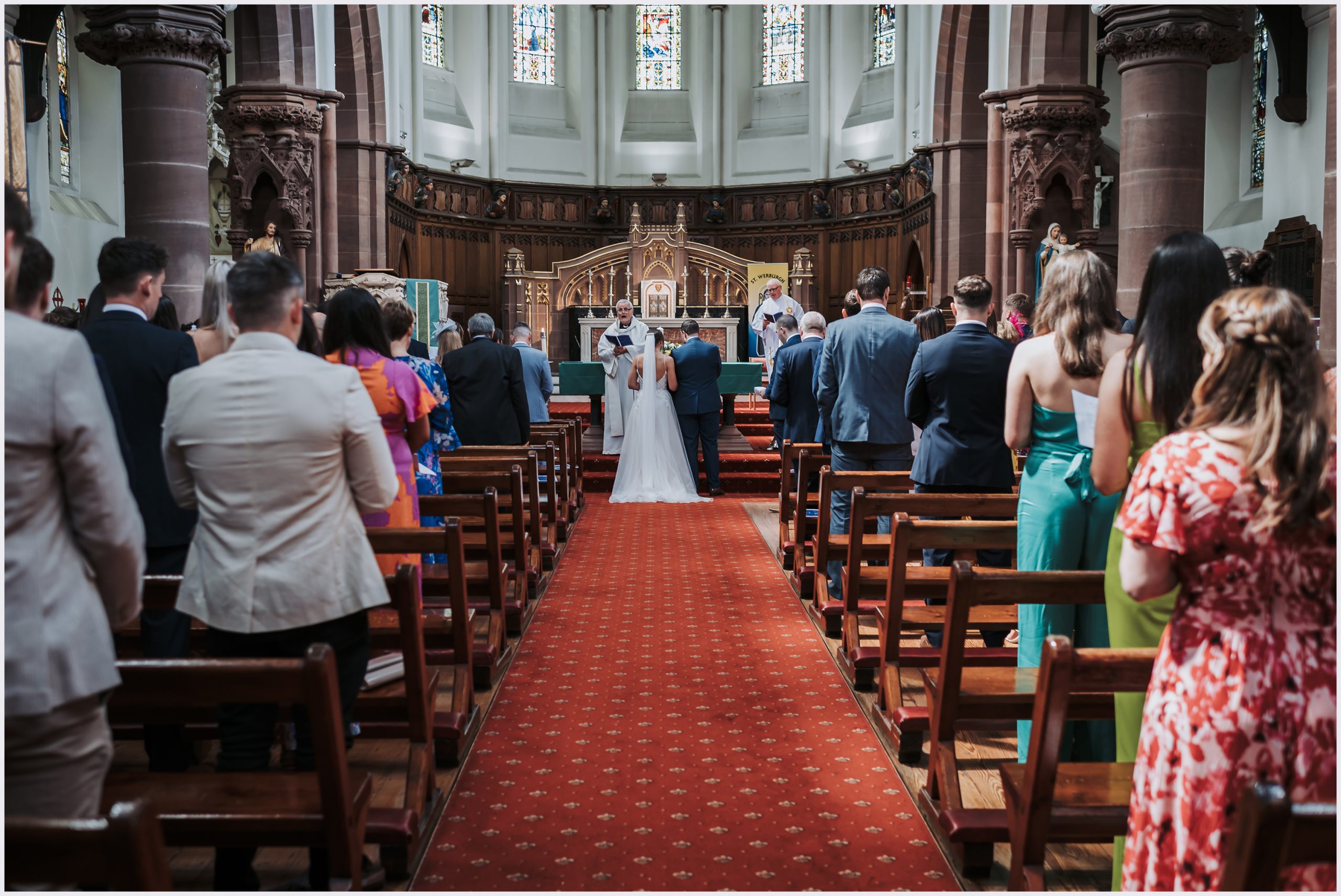The length of an aisle in a church with the bride and groom standing at the top of it during their wedding ceremony.