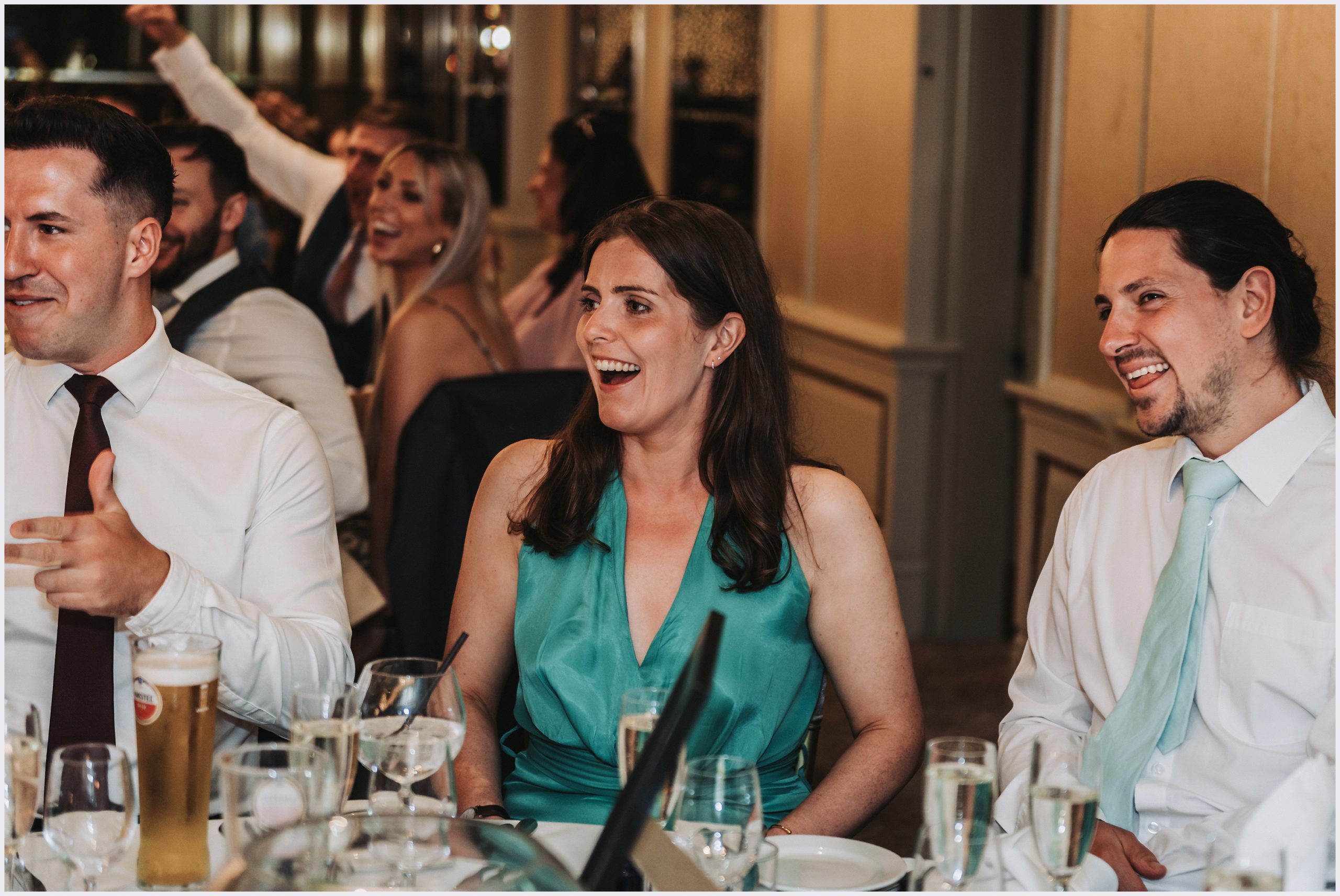 Guests laughing while the speeches are read
