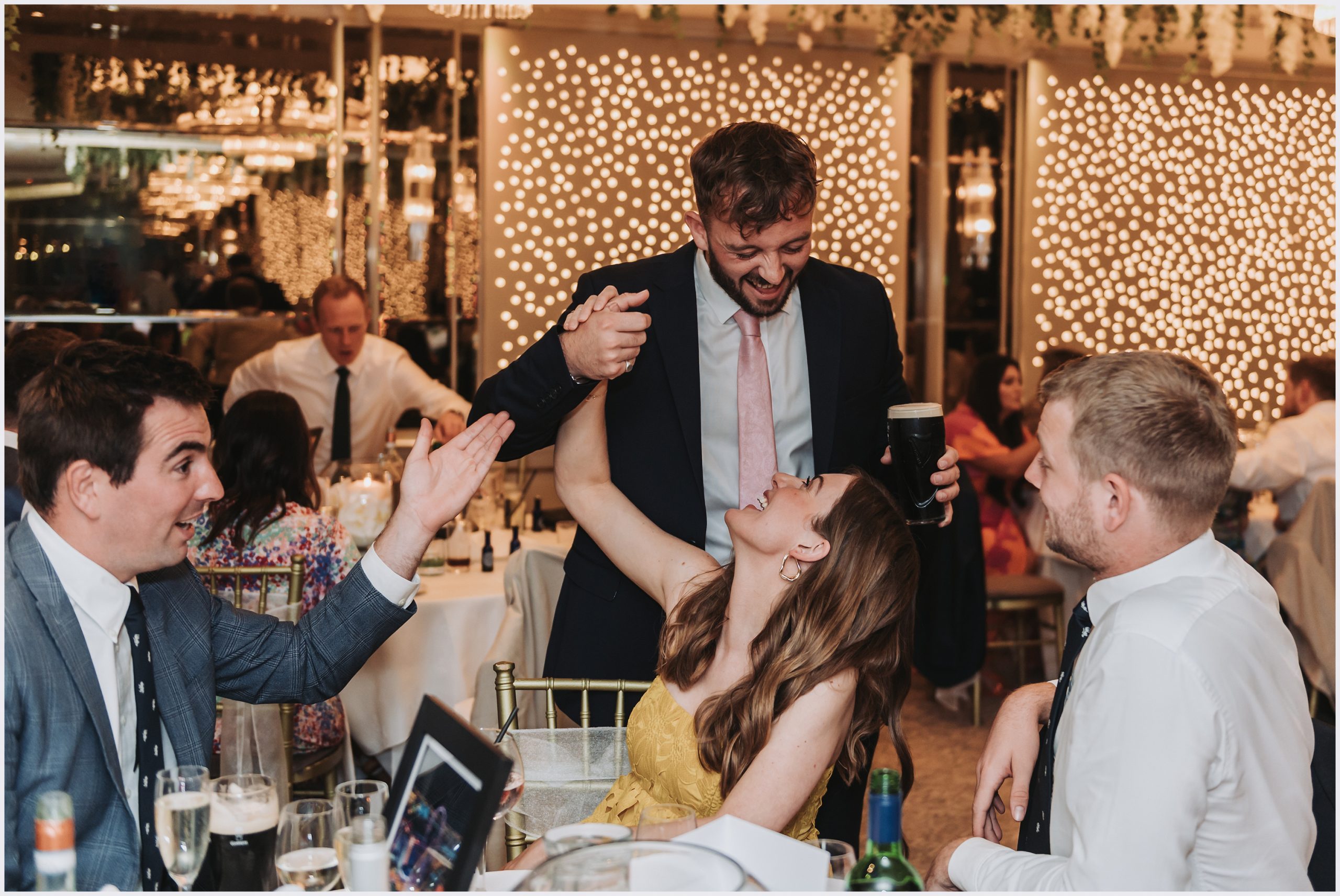 Guests joke and laugh during the wedding reception at The Grosvenor Pulford Hotel and Spa