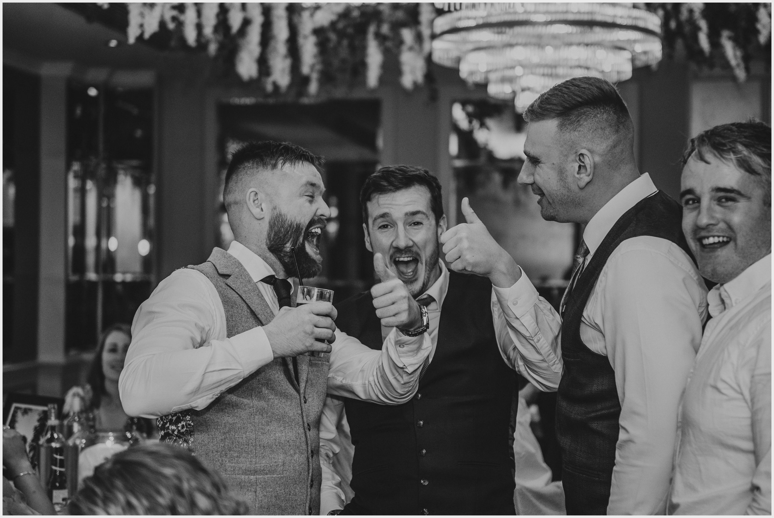 Guests joke and laugh during the wedding reception at The Grosvenor Pulford Hotel and Spa.  Image taken by Cheshire based wedding photographer Helena Jayne Photography
