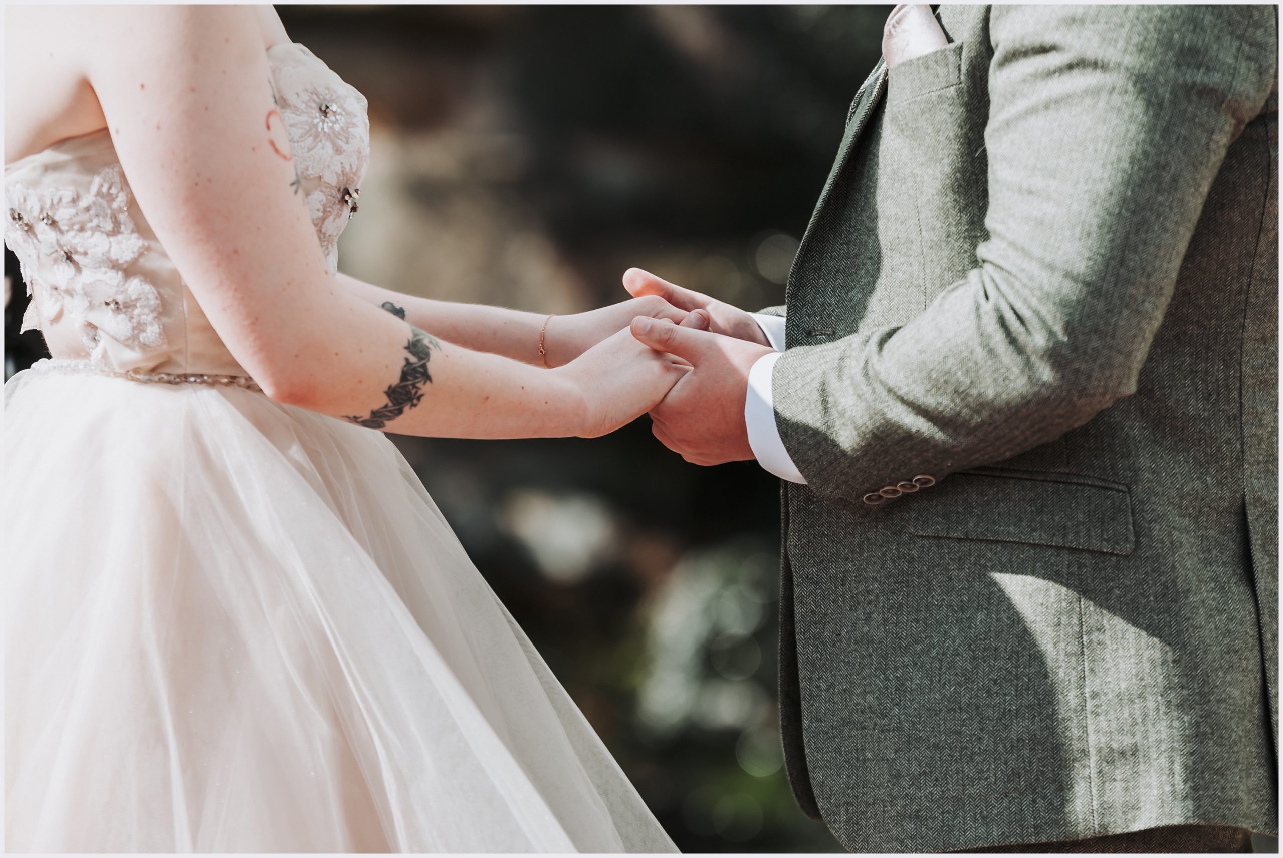 A close up of the bride and groom's holding hands during the wedding ceremony.  Image captured by helena Jayne Photography